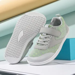 Breathable gray kids barefoot sneakers with neon green accents and non-slip rubber soles