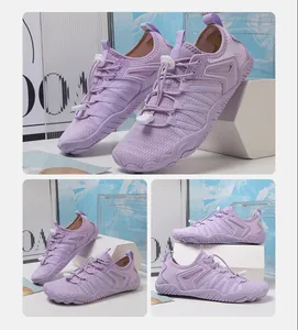 Vista laterale di scarpe da scoglio viola in mesh traspirante con lacci elastici rapidi
