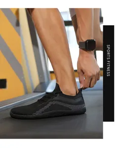 Breathable black knit sports shoes for men being used on a treadmill for fitness