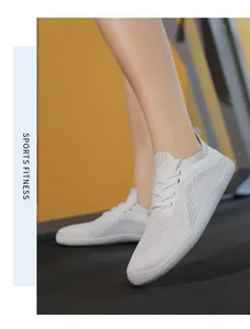 White breathable knit running shoe for fitness, shown in use on a treadmill
