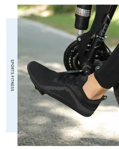 Outdoor cycling scene showing breathable black fly knit sneakers on bicycle pedals