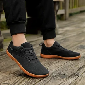 Men's wide toe box barefoot shoes in black mesh with brown rubber soles for hiking and gym