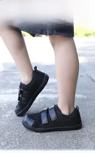 Top view of black barefoot shoes for kids with breathable mesh and dual Velcro straps