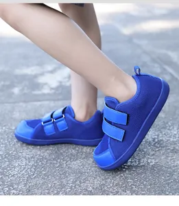 Detail of royal blue kids barefoot shoes with breathable mesh and dual velcro straps