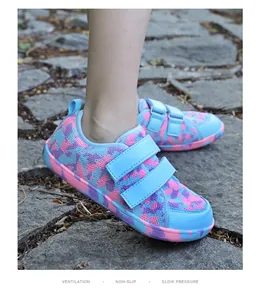 Detailed view of kids barefoot shoes with blue mesh and purple camo dual straps