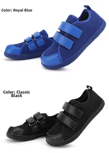 Detail view of royal blue and classic black kids' wide-toe sneakers with velcro straps