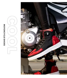 Detail of professional motorcycle boots with red TPU protection and quick rotary laces