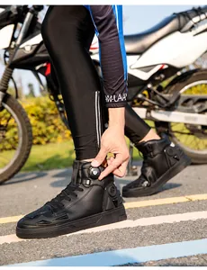 Close-up of black motorcycle riding boots with rotary lacing system and side reinforcements