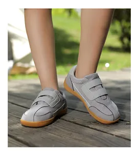 Detail of grey kids barefoot hiking shoes with breathable mesh and double velcro closure