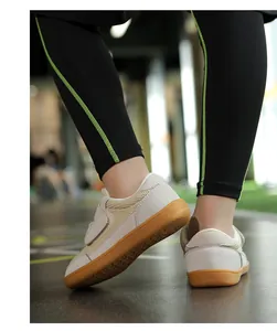 Detail view of children's wide-toe barefoot sneakers with gum rubber soles and mesh upper