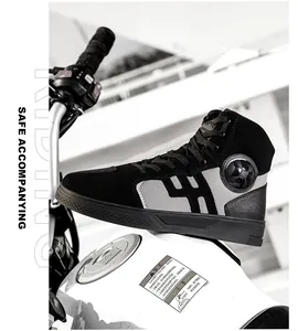 Detail view of high-top motorcycle boots with ankle protection on white fuel tank
