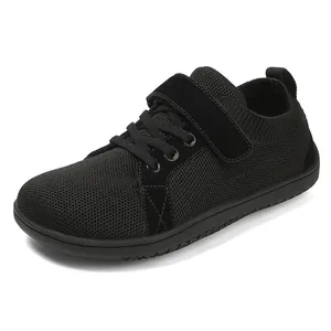 Kids barefoot sneakers in black with breathable mesh and wide toe box velcro closure