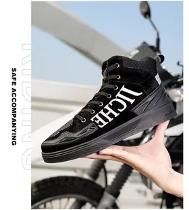 Close-up of high-top motorcycle boots featuring durable suede and anti-slip rubber soles