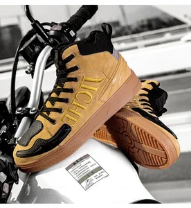 Detail of high-top motorcycle boots featuring reinforced rubber gear shift pad and suede