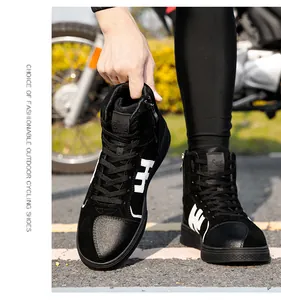 Detail of waterproof motorcycle boots with side zipper and durable leather texture
