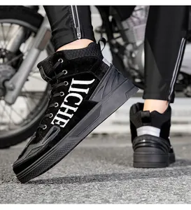 Detail of high-top motorcycle boots with IICHE embroidery and protective heel frame