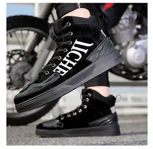 Macro detail of high-top motorcycle boots with JICHE logo and reflective heel strip