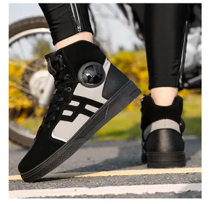 Close-up of waterproof motorcycle riding boots with ankle protection on a road