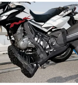 Close-up of black waterproof motorcycle boots featuring quick-lace knob and ankle protection