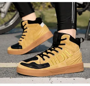 Detail of waterproof motorcycle boots with ginger suede and black protective accents