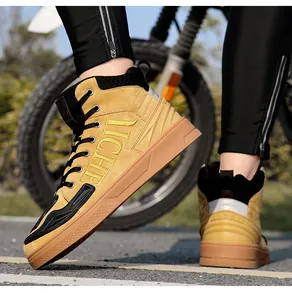 Detail of waterproof motorcycle boot with yellow suede finish and LICHE side embroidery