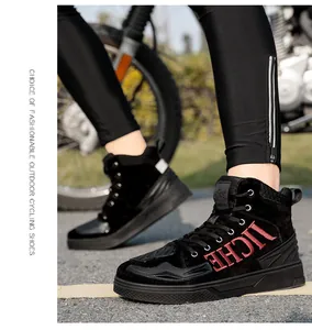 Close-up of black high-top motorcycle boots with protective suede and anti-slip rubber sole