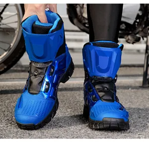 Detail of blue motorcycle boots featuring a protective shell and quick-lace knob system