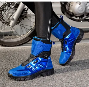 Detail of blue and black motorcycle boots featuring a quick-release knob lacing system
