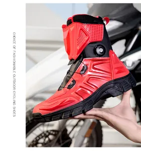 Detail of red and black motorcycle boots with rotating buckle closure and protective armor
