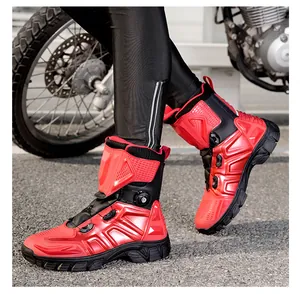 Detail of red and black motorcycle riding boots featuring side knob lacing and armor