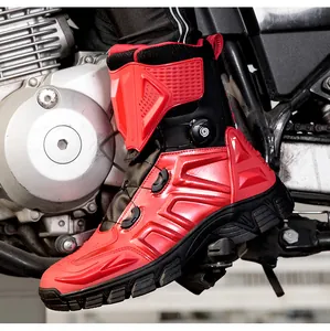 Detail of red and black motorcycle boots with knob lacing system and protective gear