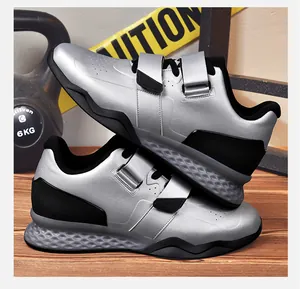Detail of silver weightlifting shoes with dual straps and honeycomb cushioning sole