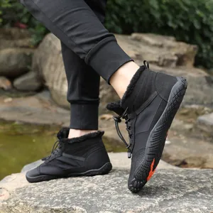 Waterproof black winter snow boots with warm fur lining and non-slip rubber soles outdoors
