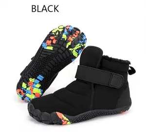 Detail view of black snow boots with plush lining and colorful anti-slip rubber outsole