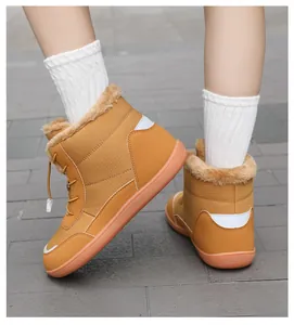 Detailed top view of waterproof winter snow boots with warm faux fur trim and rubber soles