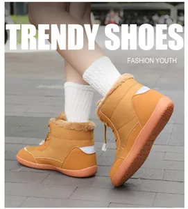 Close-up of waterproof winter boots with warm fleece lining and trendy orange drawstring