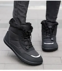 Close-up of black waterproof snow boots featuring quilted fabric and warm faux fur lining