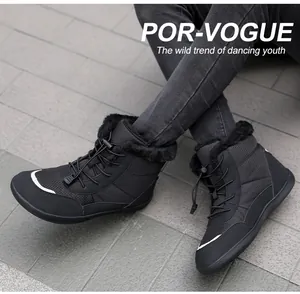 Detail of waterproof winter snow boots featuring fleece lining and bungee cord laces