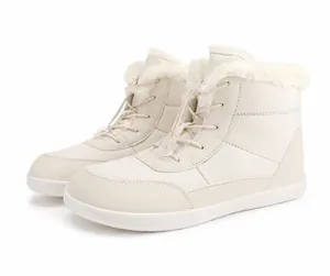 Detail of beige waterproof snow boots with warm faux fur lining and drawstring toggle