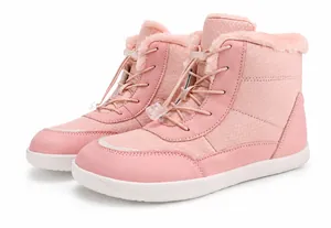 Detail view of pink waterproof snow boot featuring warm faux fur lining and drawstring toggle