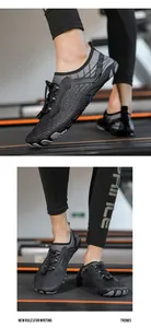 Detail of dark grey quick-dry barefoot water shoes with anti-slip rubber sole on a treadmill