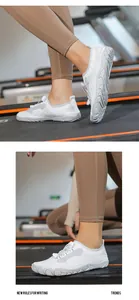 Macro detail of breathable mesh upper and quick-lace system on white outdoor sneakers