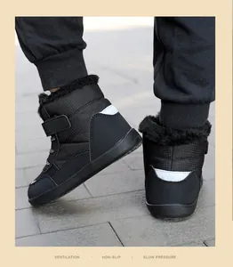 Detail of children's thermal snow boots showing faux fur lining and reflective heel patch