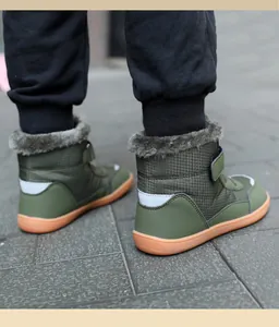 Rear view of army green winter boots for children with faux fur lining and reflective strips