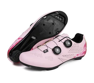 Detail view of pink road cycling shoes featuring dual rotary buckles and 3-hole cleat sole