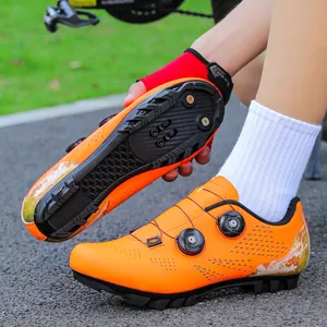 Orange professional mountain bike cycling shoes with double rotary buckles and SPD sole