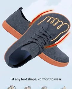 Macro detail of wide toe box on gray flyknit barefoot shoes with orange rubber soles