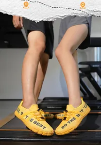 Couples wearing yellow wide-toe fitness shoes in a gym setting for treadmill running