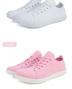 Detail view of pink and white wide toe box walking shoes with breathable knit upper