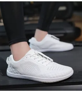 Kids barefoot running shoes on a treadmill featuring breathable white mesh upper